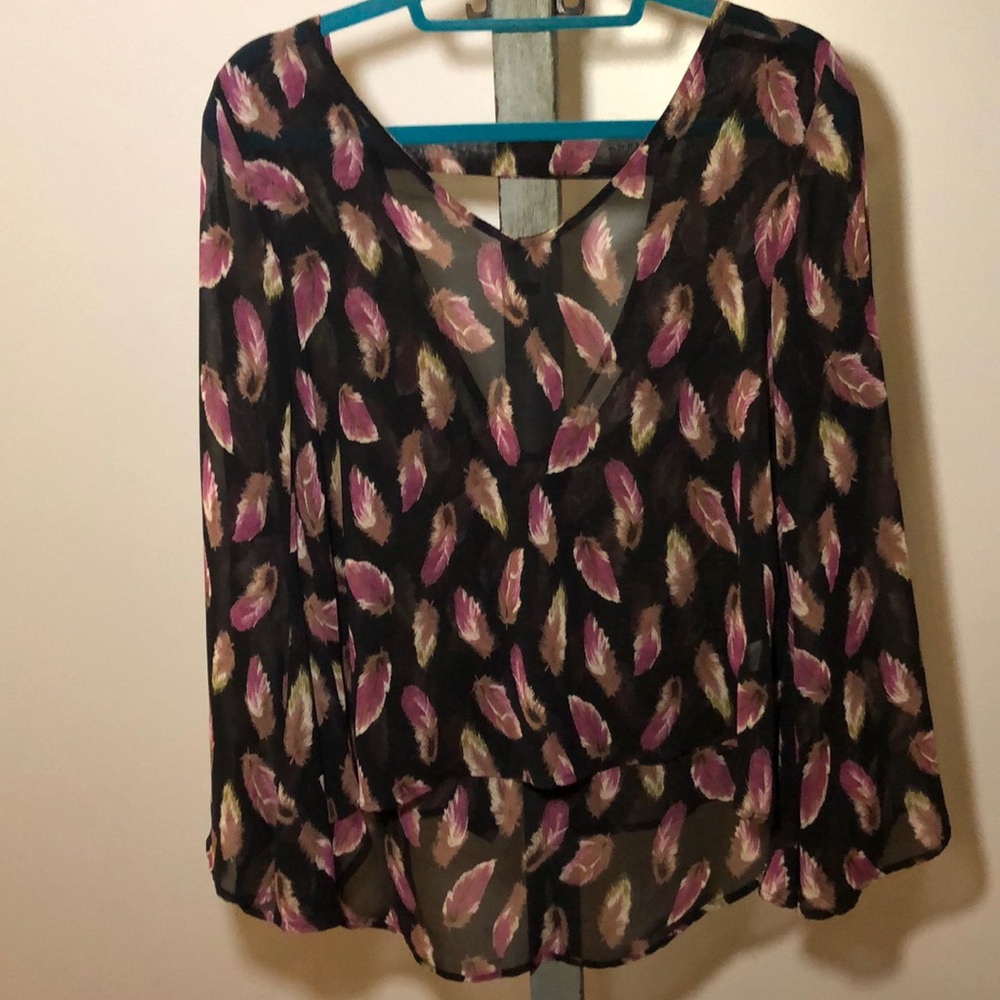 Black sheer top with a feather print.